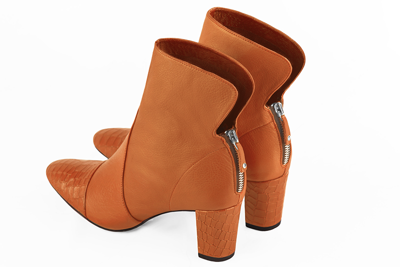 Apricot orange women's ankle boots with a zip at the back. Round toe. Medium block heels. Rear view - Florence KOOIJMAN